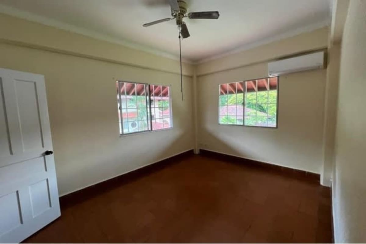 Large kitchen white cabinets, double sink, ample workspace renovated Albrook Panama home