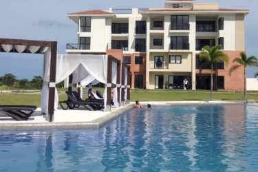 Large resort pool area with lounge chairs at Casa Real Vista Mar San Carlos Panama