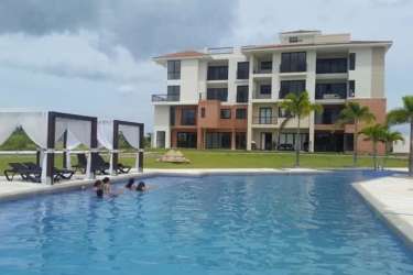 Contemporary beachfront condo with pool and cabanas at Casa Real Vista Mar