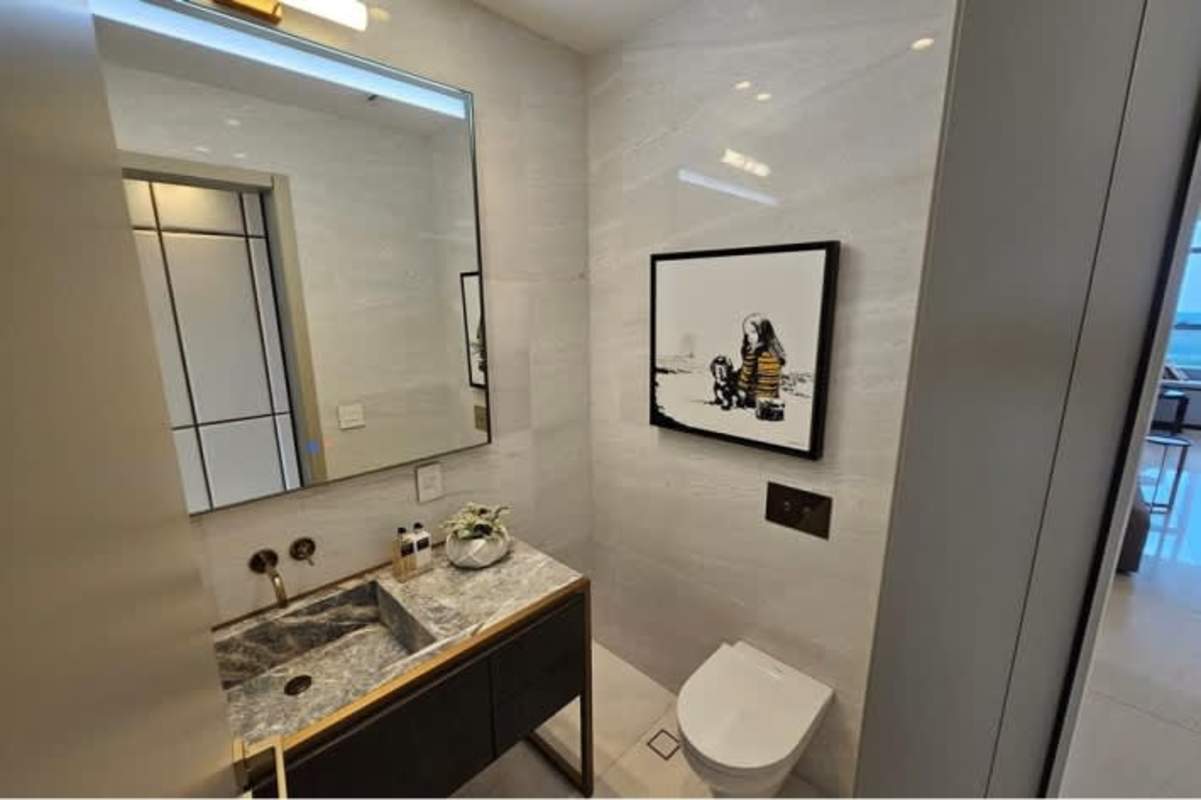 Spacious luxury living room with floor-to-ceiling windows ocean and golf views La Maison Fendi Panama