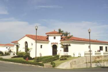 Elegant entrance with red clay roof tiles Mediterranean home Vista Mar Panama