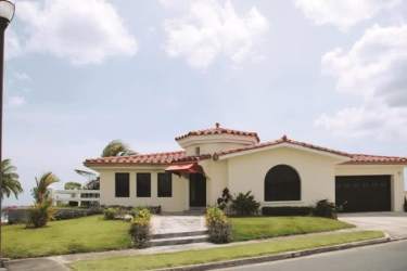 Stylish coastal villa with Mediterranean design white stucco red tile roof near Pacific beach Panama