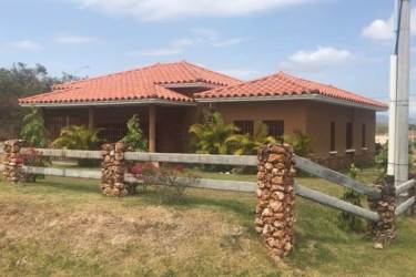 Mediterranean garden pavilion with tiled roof white columns in Rodeo Viejo Country Panama