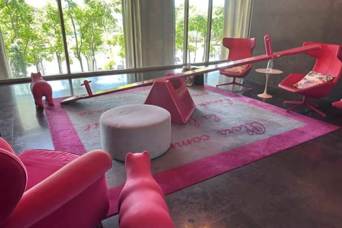 Unique playful lounge with pink decor and window views in Yoo Panama luxury tower Avenida Balboa