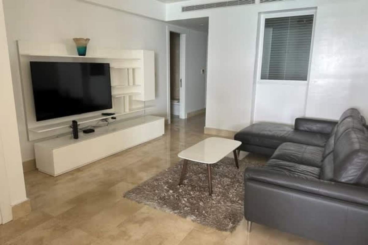 Balcony with glass rail and sweeping oceanfront city skyline at Yoo Panama Avenue Balboa