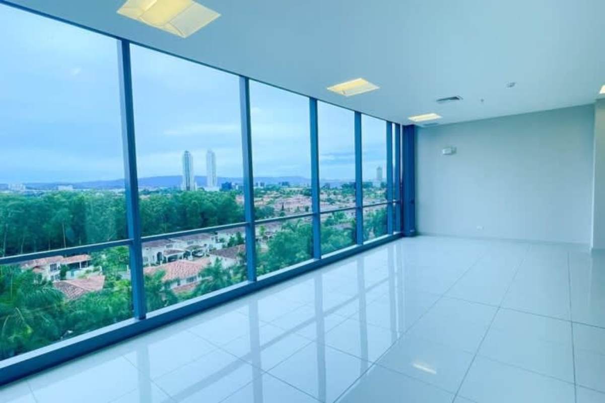 Office interior with large windows and city skyline view Plaza Boulevard del Este Panama
