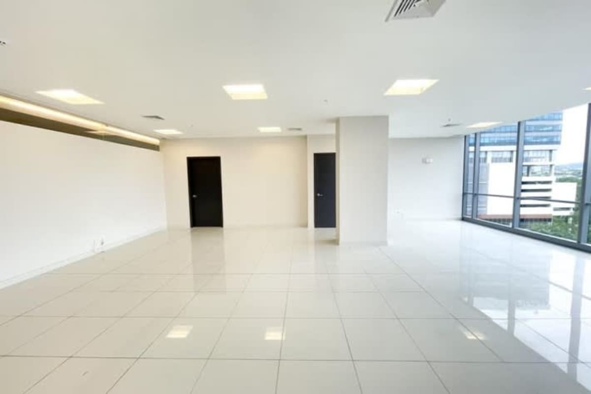 Spacious empty modern office with floor-to-ceiling windows panoramic city views Costa del Este