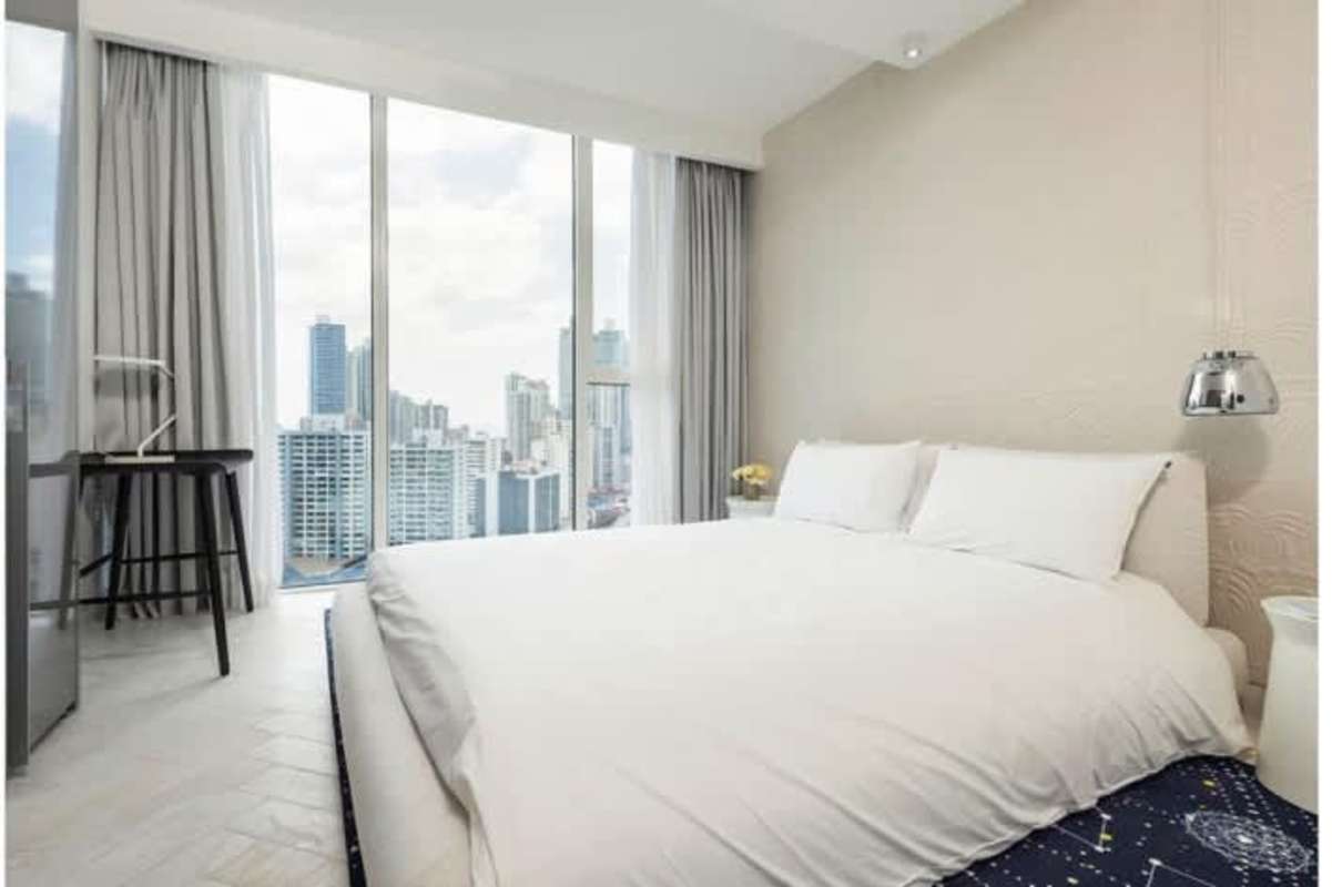 Modern living room with large windows panoramic ocean view luxury apartment Marbella Panama