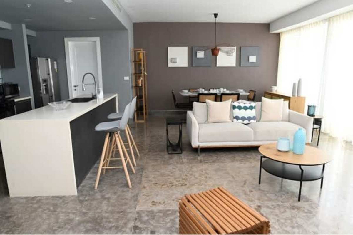 Cozy living space with TV, art walls, modern furniture in Yoo Panama Arts Tower