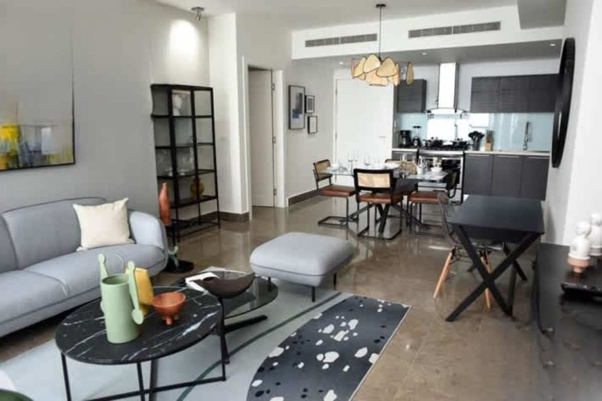 Luxury bedroom with large window overlooking ocean Yoo Panama Panama City