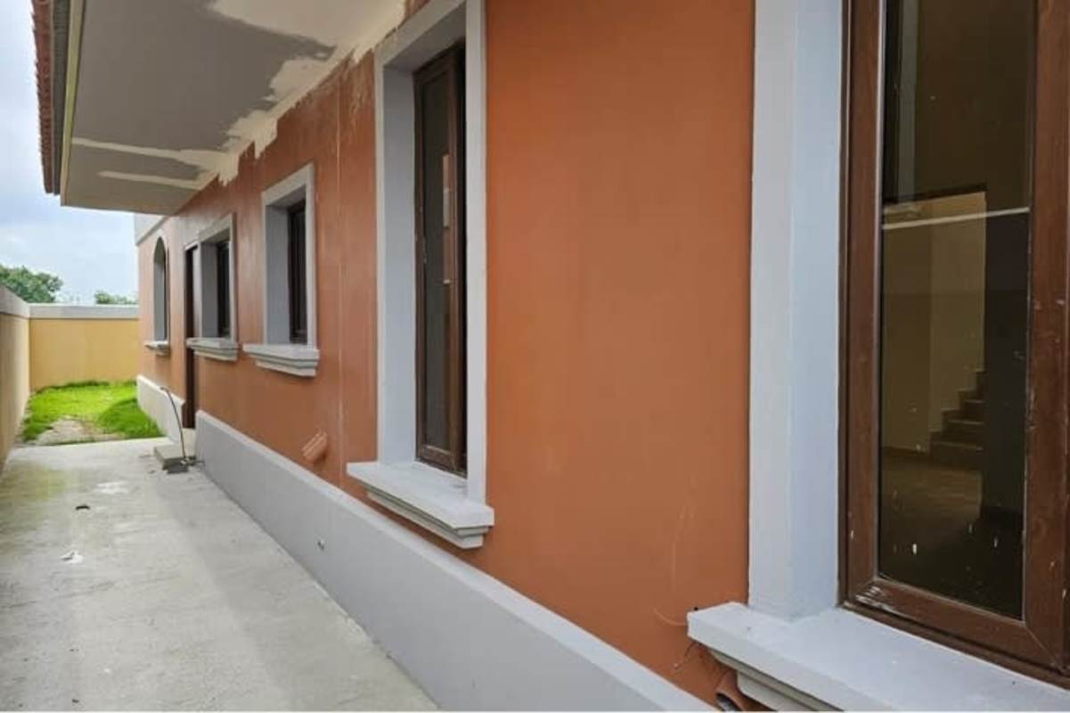 Side exterior view of luxury home with terracotta tones in El Doral Costa Sur Panama City