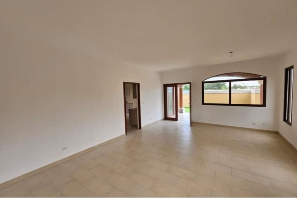 Luxury modern kitchen with granite countertops and wooden cabinets in Costa Sur Panama