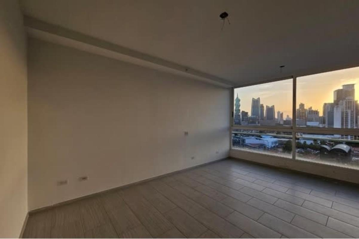 Bright living room with floor-to-ceiling windows and city views PH The Towers Panama