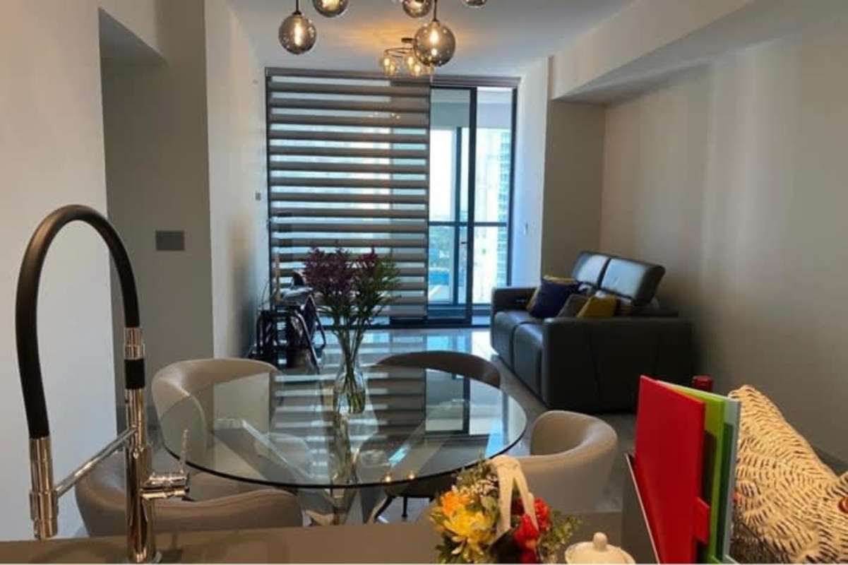 Modern indoor spa lounge with jacuzzi and panoramic skyline windows at Nuovo by Armani Panama