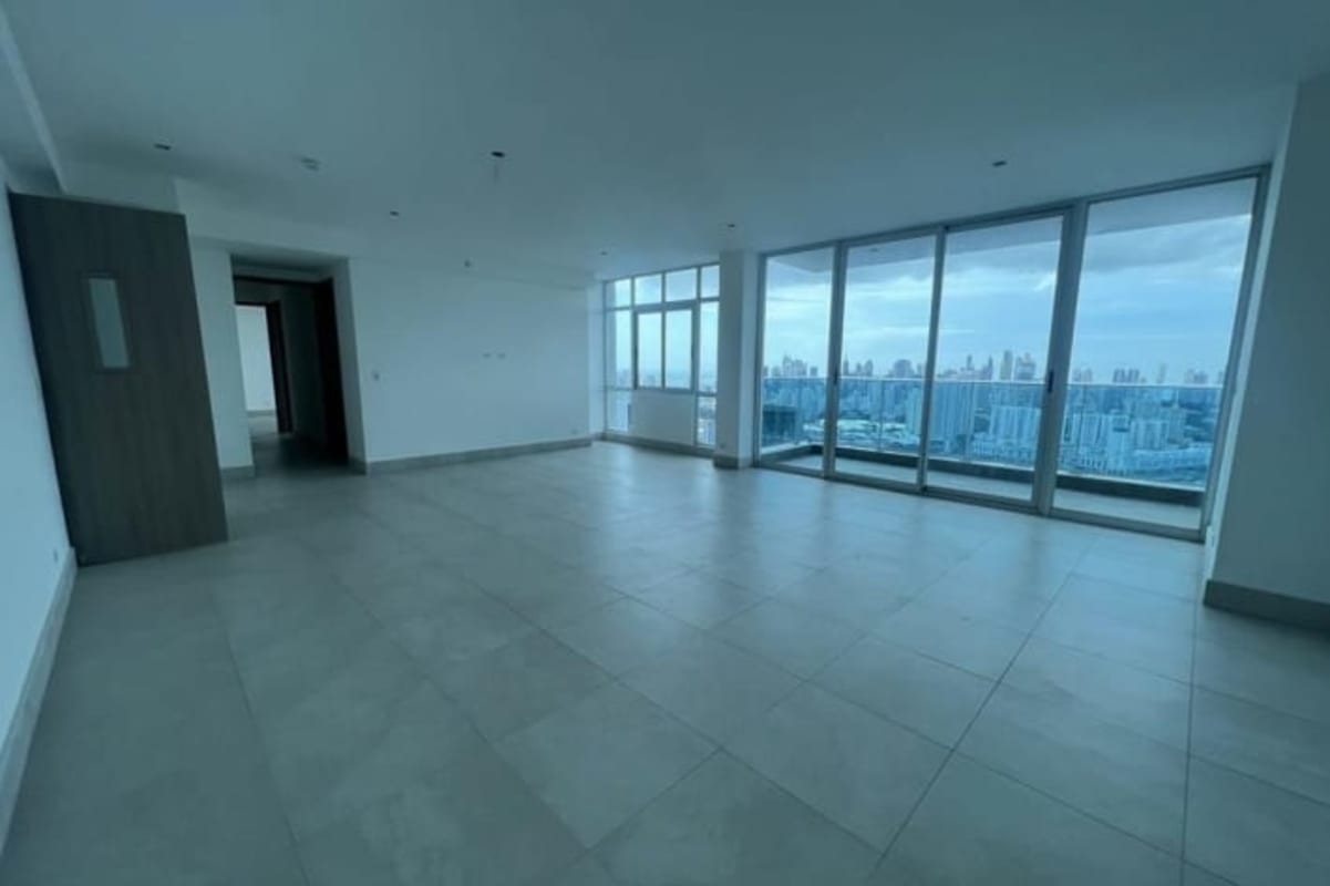 Modern open living room with large windows offering panoramic skyline views in PH Pacific Hills Betania Panama