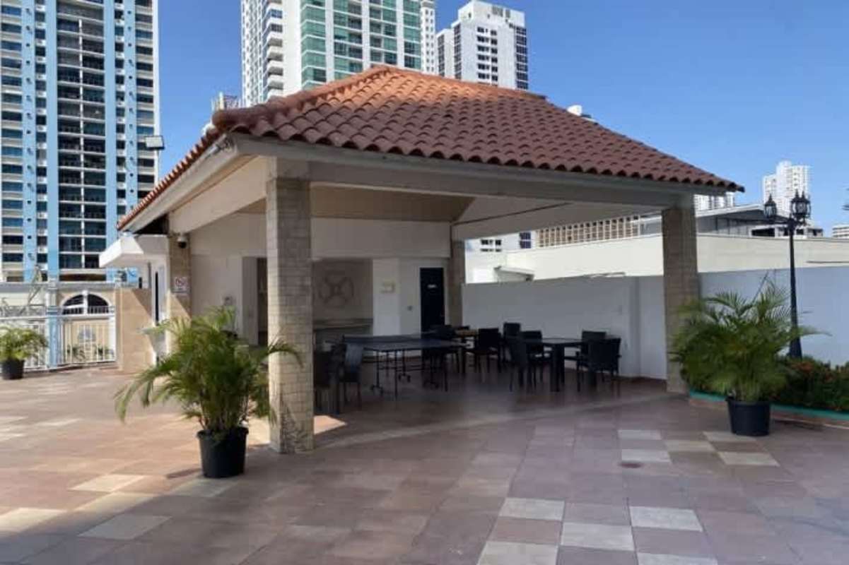 High-rise condo exterior with pool, playground, tennis at PH San Francisco Bay Panama