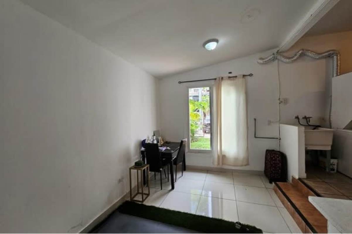 Wide hallway with tile floor leading to multiple rooms inside commercial house Obarrio Panama