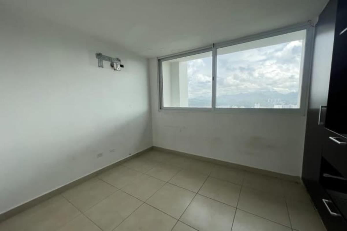 Empty bedroom with large windows overlooking Condado del Rey Panama in PH Kings Park condo tower