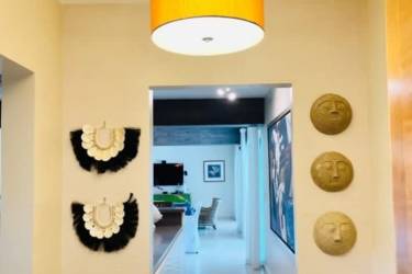 Bright furnished living-dining area with balcony and ocean views in Bijao Beach Club Residences