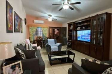 Suburban house with covered parking area and tiled roof in gated Altos del Campo La Chorrera Panama