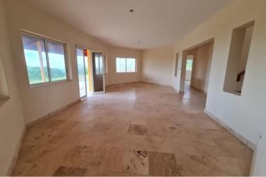 Spacious living room with tile floors large windows mountain views Las Lajas Panama