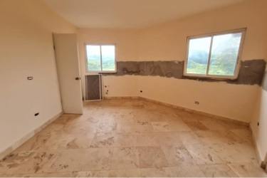 Kitchen area with tile floors windows light Chame Panama countryside house