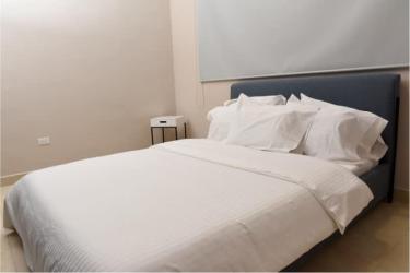 Modern open-plan living area with floral accent wall and dining space at Paradise Point house