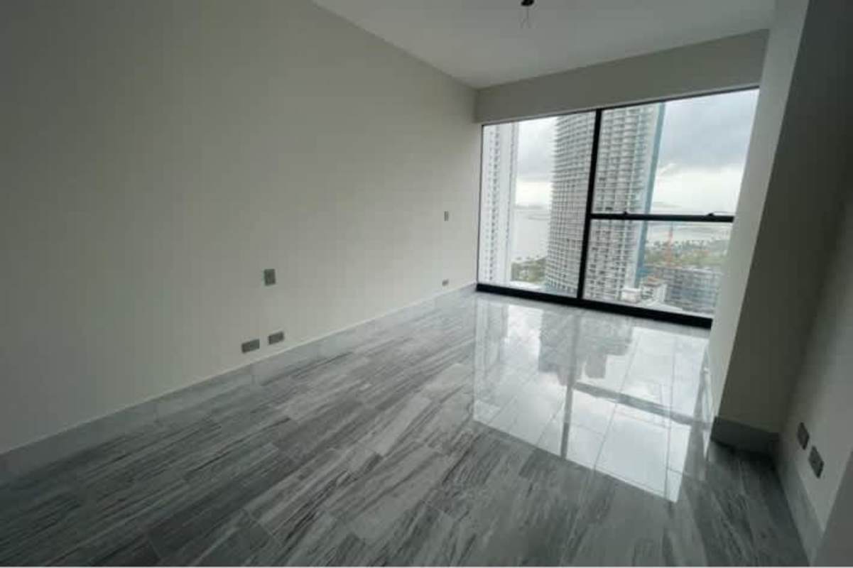 Unfurnished master bedroom with floor-to-ceiling windows and ocean view in PH Nuovo by Armani