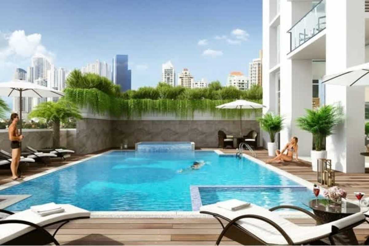Infinity pool with city views and sun deck at The Colonial Santa María Panama