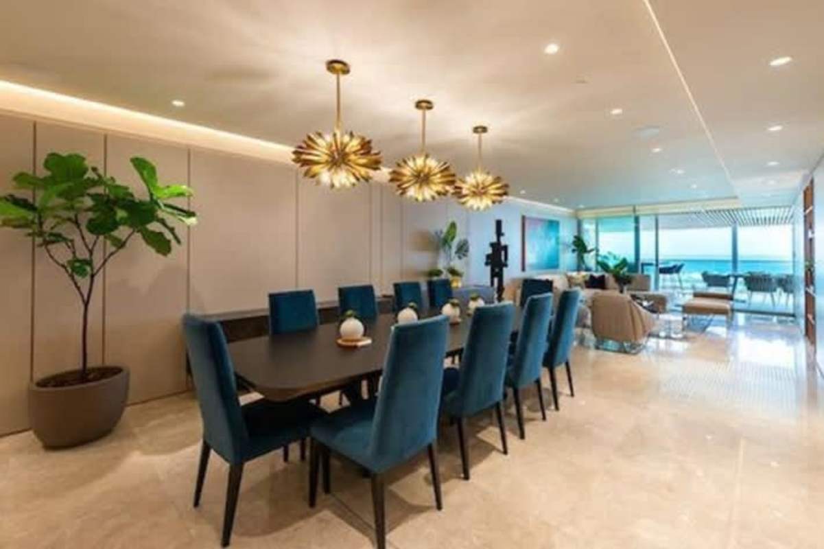 Dining area connected to living room with ocean views PH Costanera Panama City