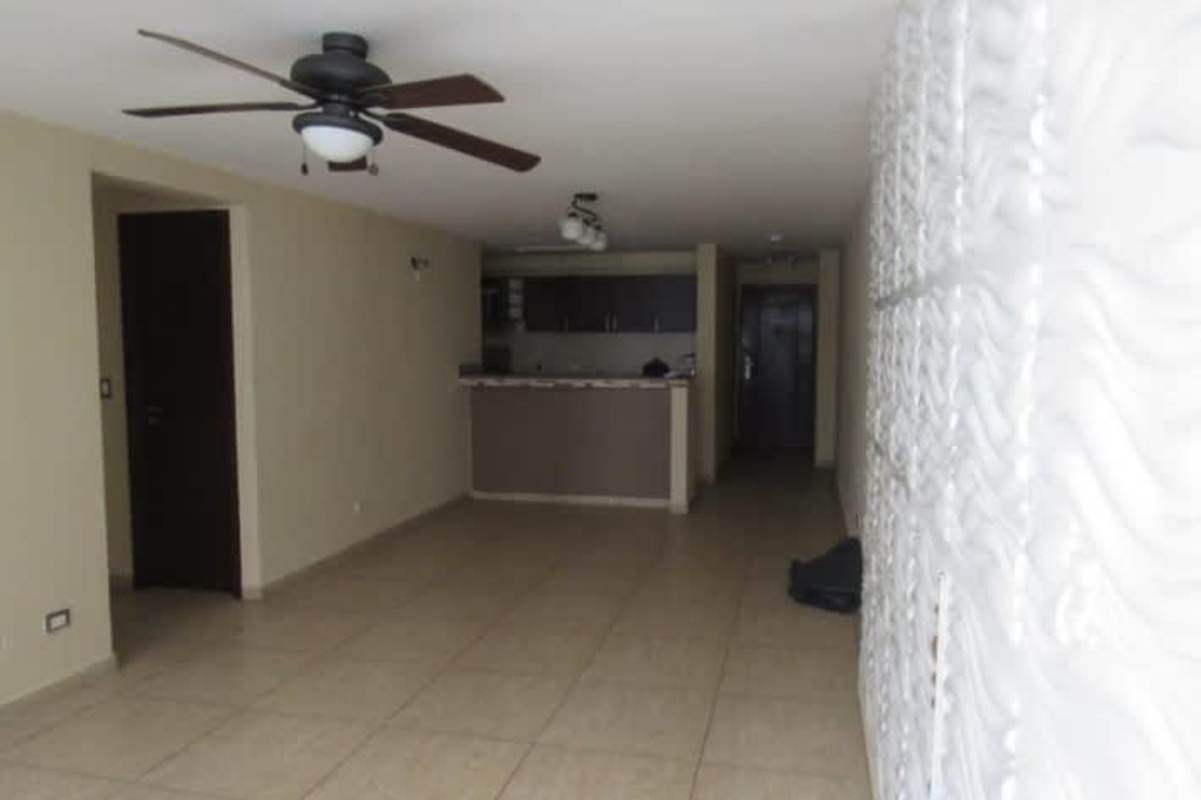 Living room area with open kitchen granite bar tile floor PH Terrazas del Rey Panama