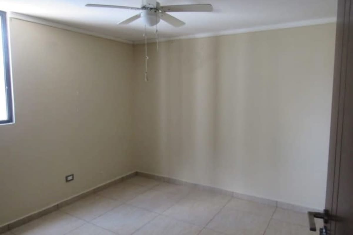 Second bedroom with closet, tile floor, window in PH Terrazas del Rey Condado del Rey