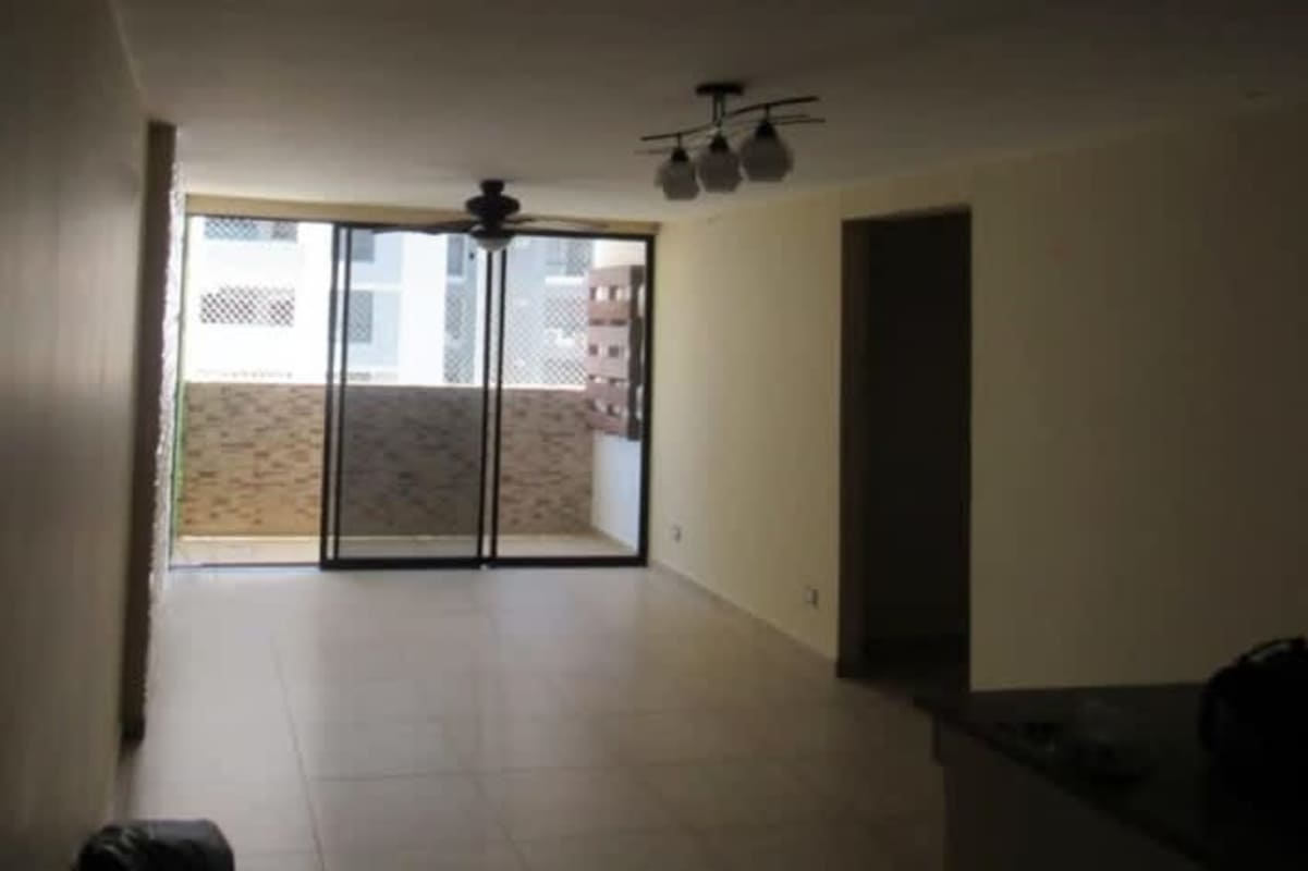 Living space with ceiling fan and sliding doors to private balcony PH Terrazas del Rey Condado del Rey