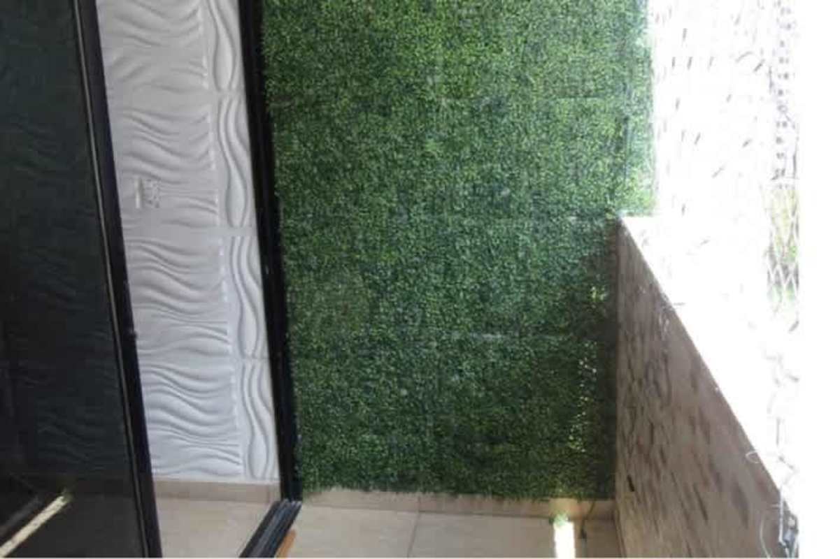 Contemporary kitchen with granite breakfast counter and dark cabinets PH Terrazas del Rey Panama