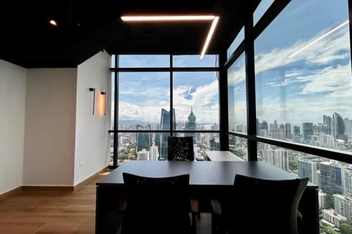 Bright open-plan coworking office space with panoramic windows Tower Financial Center Panama City
