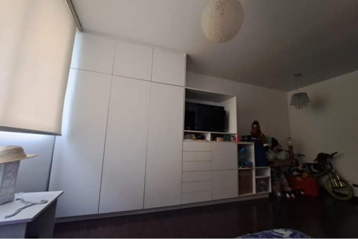 Spacious master bedroom with large windows, ocean and city views in PH Vista del Mar Panama City