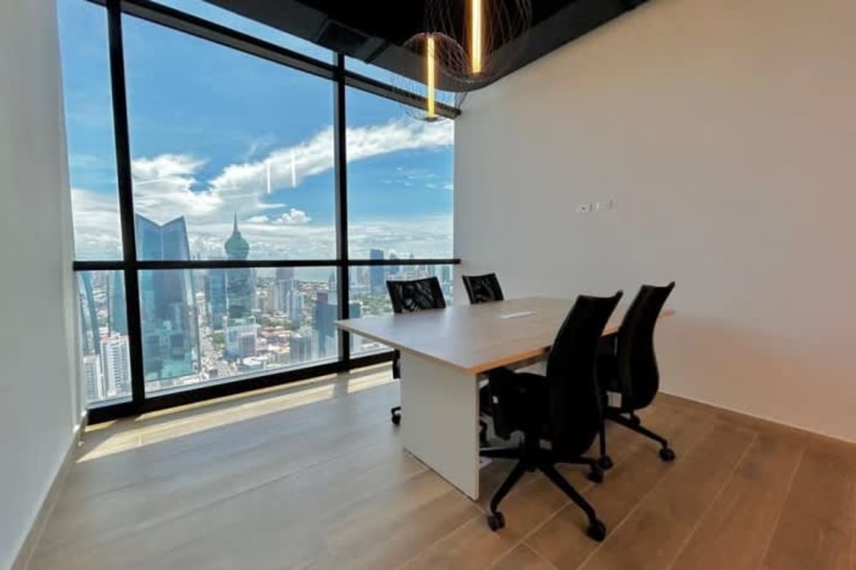 Open-plan workstations floor-to-ceiling windows skyline view Tower Financial Center Panama