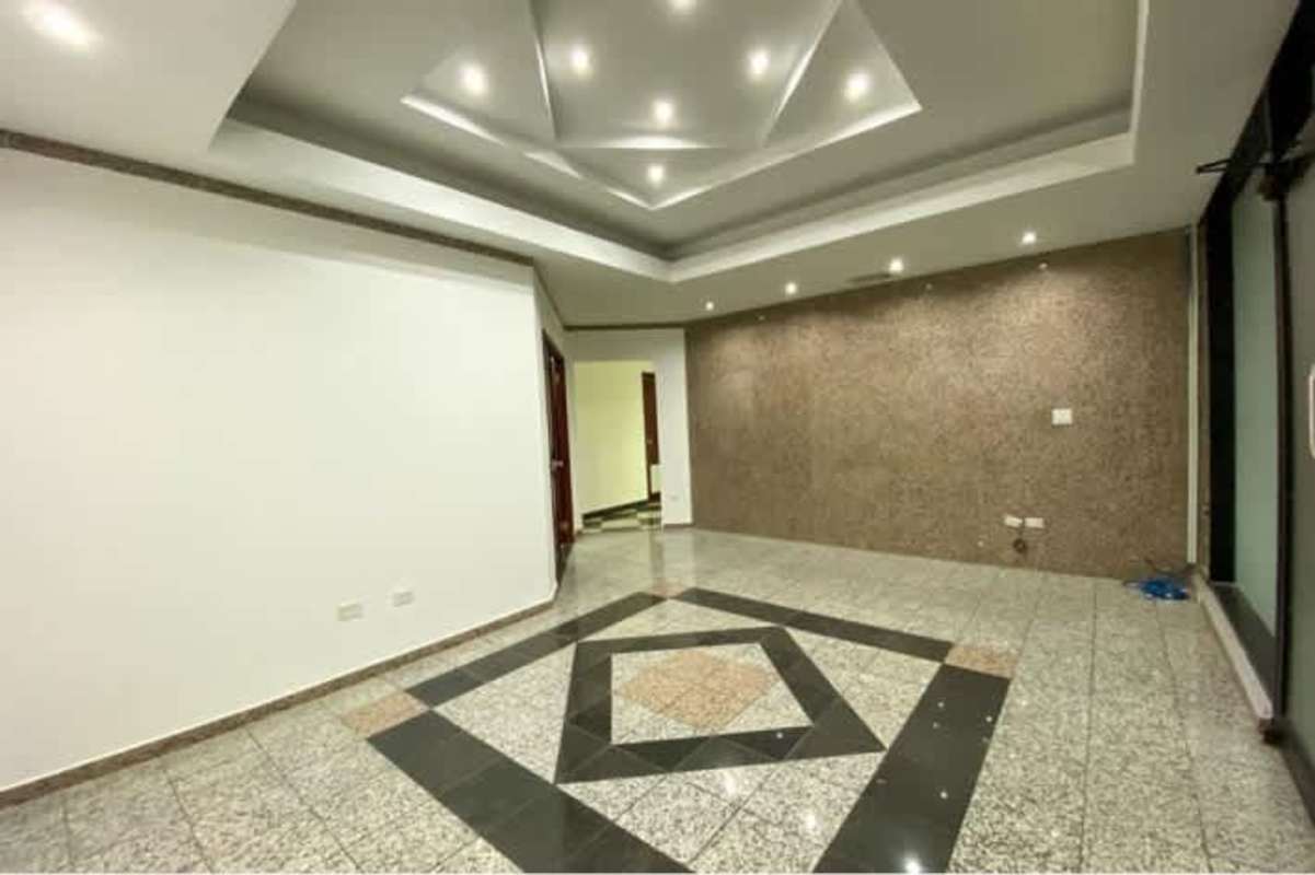 Modern tiled floor, tray ceiling, accent wall in commercial office lounge PH BICSA Tower Panama