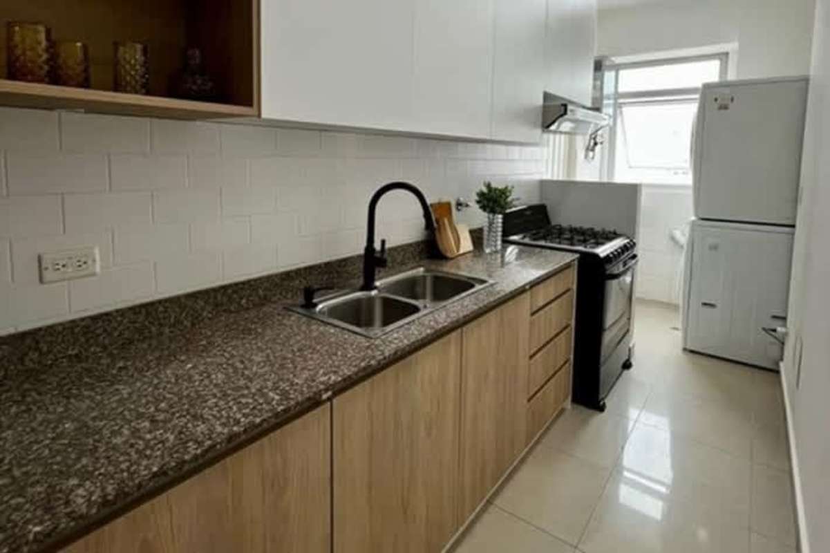 Bright living room with balcony, tiled floors, modern furnishings in PH San Francisco Bay Panama City