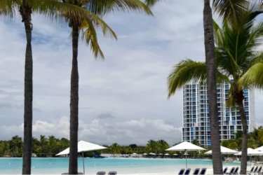 Oceanfront resort pool area with sun loungers and umbrellas at PH El Peñón de Farallón