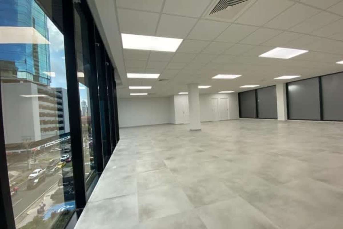 Modern corporate office with open floorplan and panoramic windows along Avenida Samuel Lewis Panama