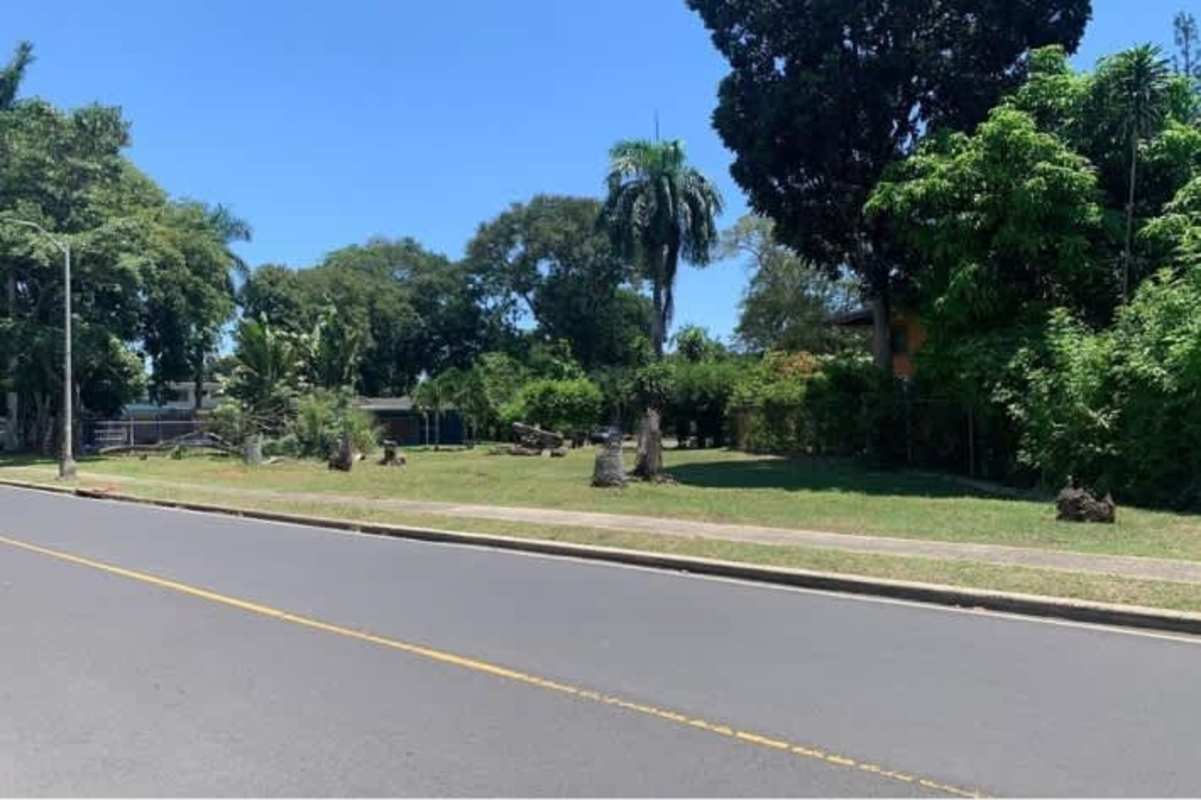 Vacant commercial corner lot with lush trees along La Boca main road, Panama