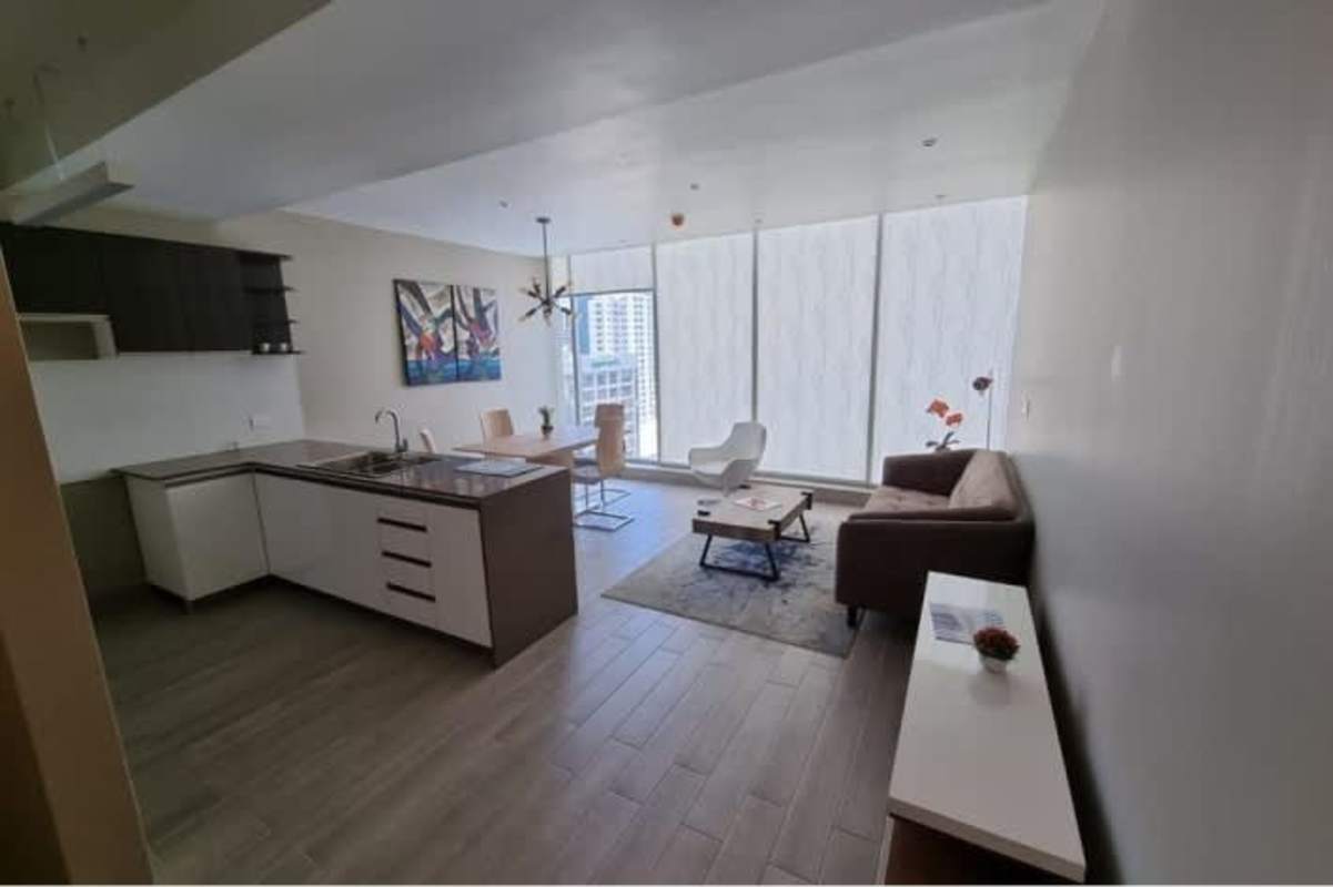 Modern open-concept living dining and kitchen area with large windows PH Azurre 42 Bella Vista Panama City
