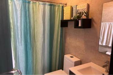 Contemporary kitchen with granite countertops, orange accent Ibiza Residences Panama beach villa