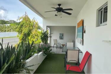 Outdoor covered patio with lounge furniture Ibiza Residences Bijao beach villa Panama