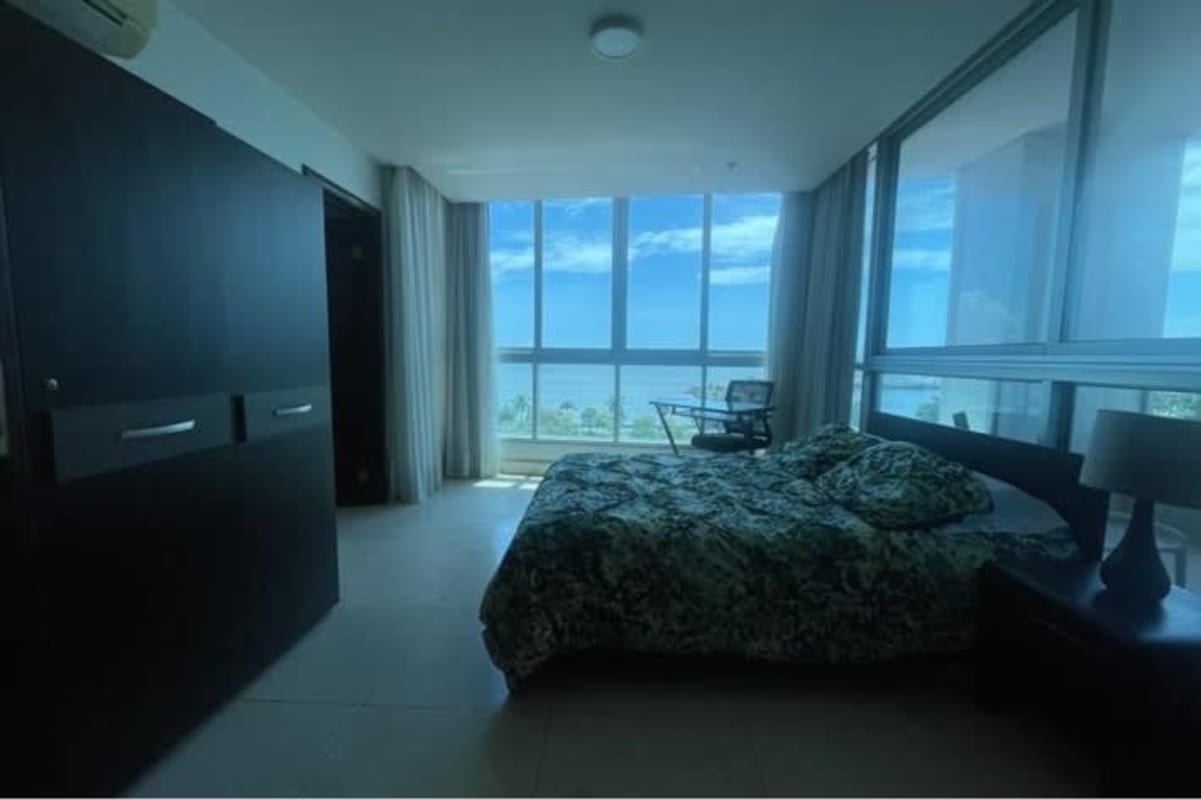 Modern bedroom with panoramic ocean views and tiled floors PH Villa del Mar Panama City