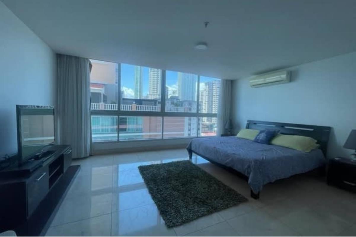 Spacious master bedroom with large windows city skyline flat screen TV PH Villa del Mar Panama