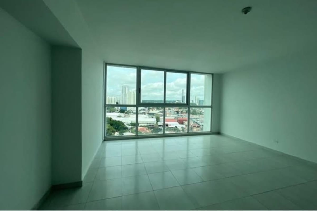 Bedroom with built-in wooden wardrobe and tile floors in PH El Cangrejo Panama