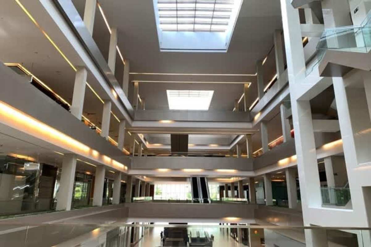 Multi-level atrium with escalators and glass railings in Ocean Mall Panama City