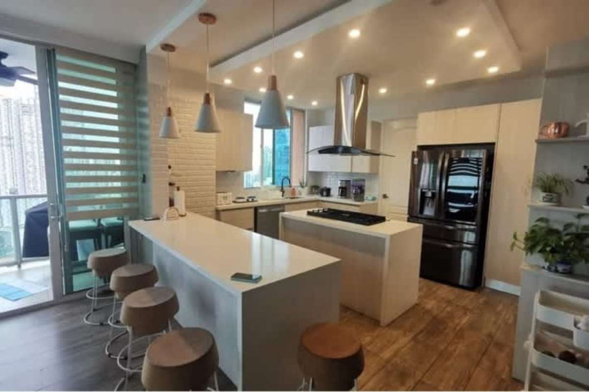 Remodeled kitchen with island, granite countertops, stainless appliances PH Aqualina Punta Pacifica Panama